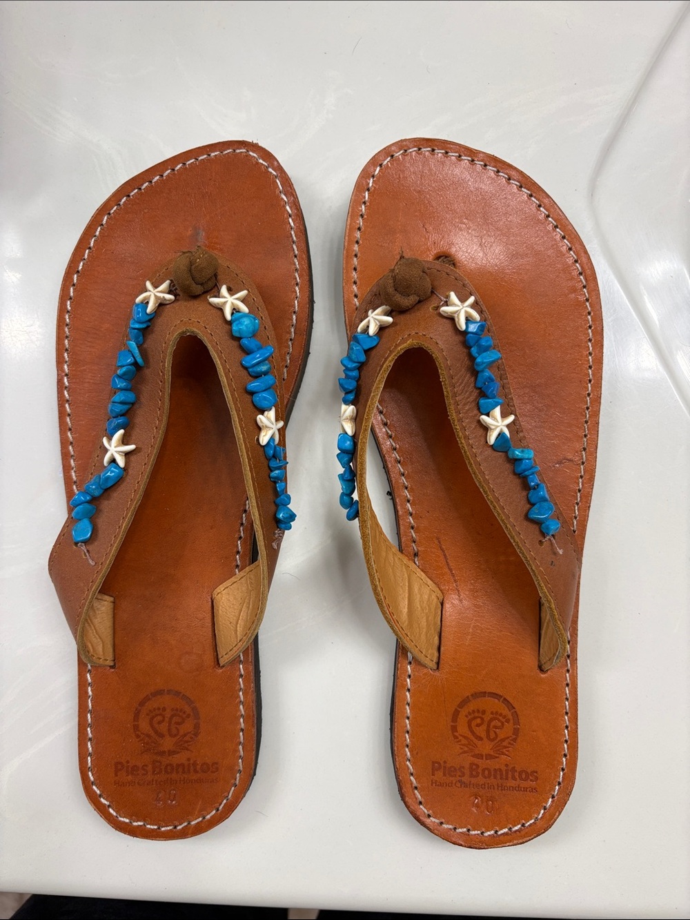 Never worn Brown Leather Sandals with Blue Bead Accents.